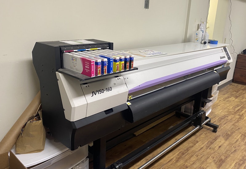 A dye sublimation heat press machine in the East Coast Printers shop.