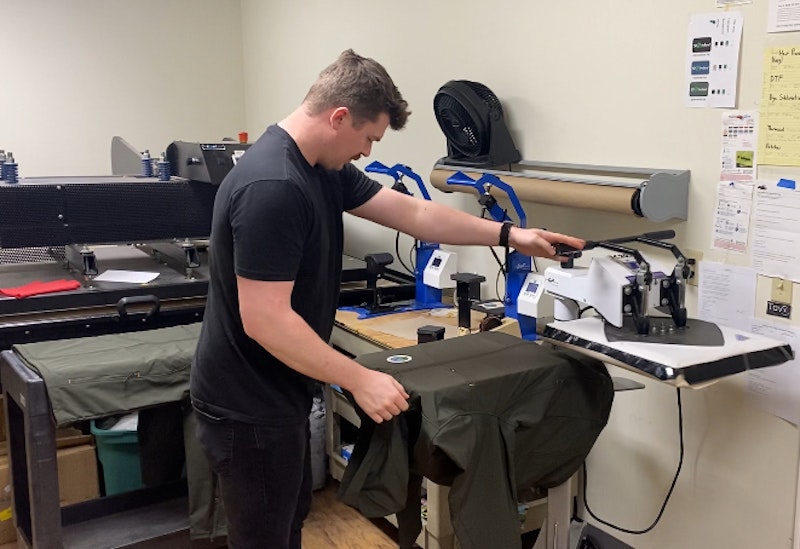 A direct-to-film (DTF) printing machine in the East Coast Printers shop.
